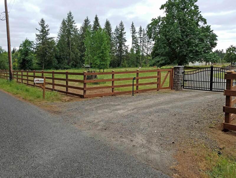 farm fence with iron swing gate