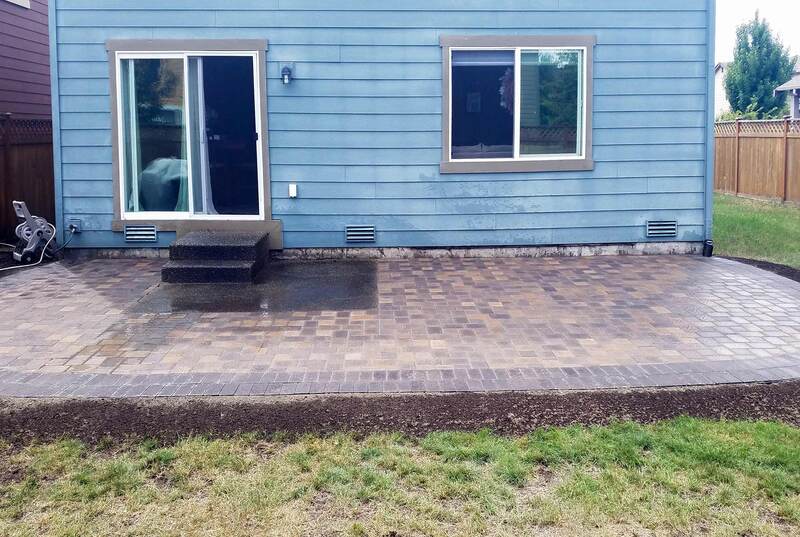 paver patio extends the entire width of the house