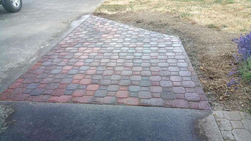 small paver extension between concrete walkway and driveway