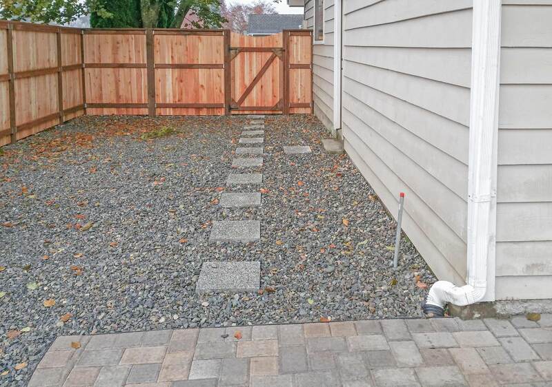 gravel, paver patio and security fence