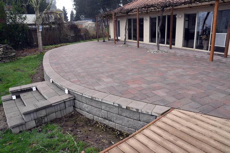 Paver patio with grapevines
